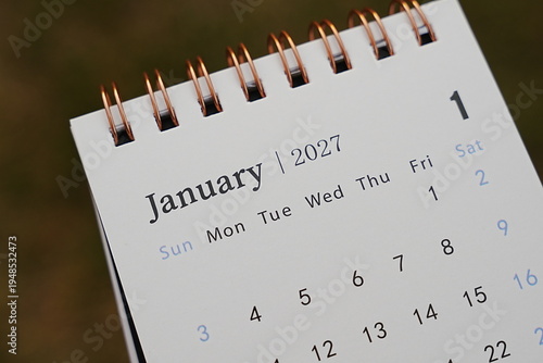 A close-up view of a calendar page displaying January 2027, showcasing the date layout and design. Perfect for time management, planning, or seasonal marketing themes.