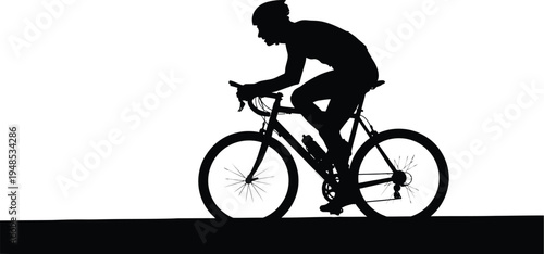 Silhouette of a cyclist riding a bicycle on a flat surface