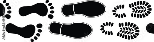 Collection of black silhouettes of human footprints in various sizes