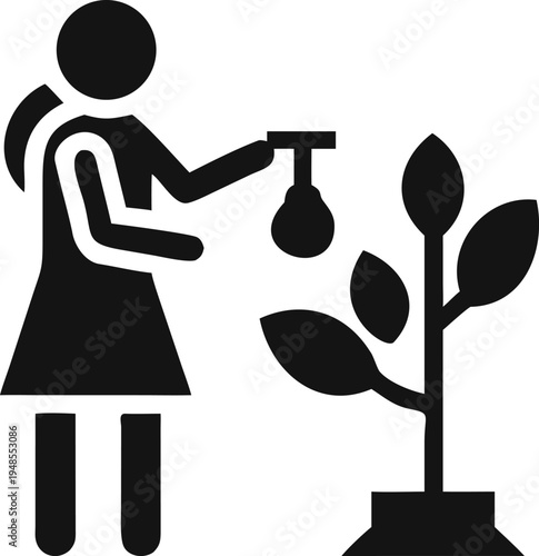 Woman applies fertilizer to a growing plant, promoting its health and robust development