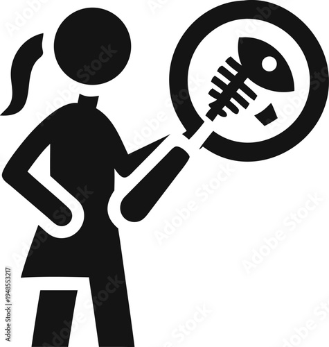 Woman investigates the anatomical structure of a fish skeleton using a large magnifying glass