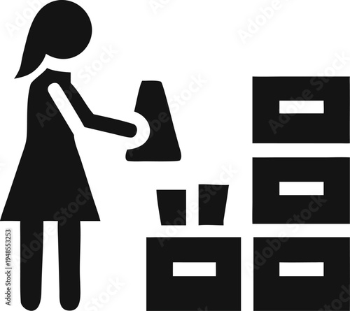 Woman organizing items into storage boxes preparing for relocation or inventory management