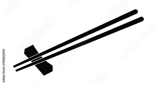 Black chopsticks with a chopstick rest on a plain white background