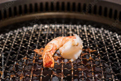 Raw beef slice on grille for barbecue or Japanese style yakiniku