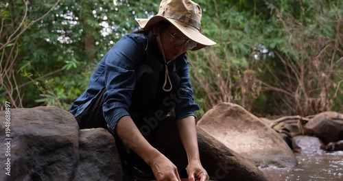 Thai Woman Washing Coffee Beans in Mountain Stream