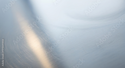 Blurred gray metallic surface with light reflection