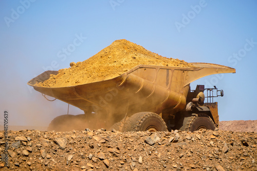 Western Australia mining town of Kalgoorlie a heavy mining dump truck hauling dirt across open pit