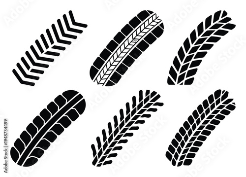 Collection of Six Black Tire Treads on White Background