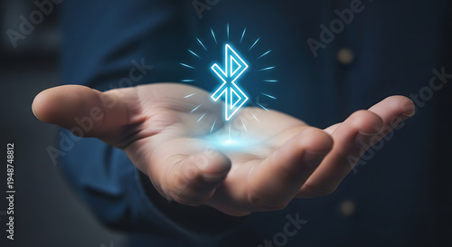 Plakat Glowing bluetooth icon hovering over open hand