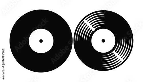 Two black vinyl records, one with grooves, on a white background