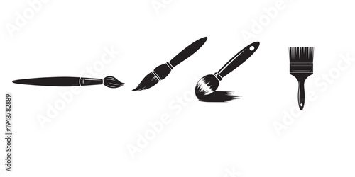 A set of four makeup brushes on a white background