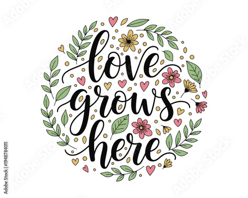 A circular floral arrangement surrounding the inspirational hand lettered phrase love grows here