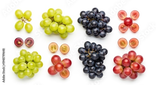 An overhead view showcasing different varieties of grapes, including green, red, and dark grapes, some whole and some cut in half on a white background.