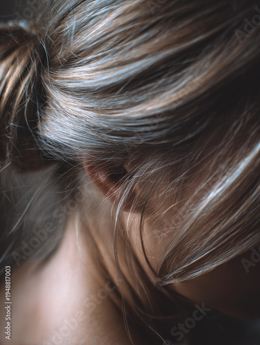 Cose-up of natural light blonde hair strands with soft light