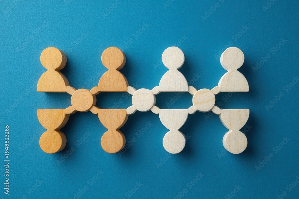 Obraz premium Networking: A visual representation of interconnectedness, depicting wooden figures linked together to illustrate collaboration and relationships, promoting ideas of unity and teamwork.