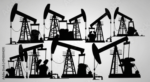 Silhouette of Oil Pumps - Extracting Resources in a Monochrome Landscape.