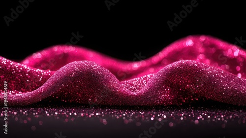Vibrant pink sequined fabric with dazzling light reflections on a dark abstract background