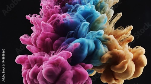 Vibrant colorful ink clouds float suspended in dark water creating abstract shapes