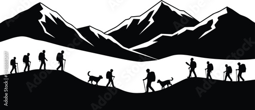 Hikers and dog walking on mountain peaks with snow capped mountains