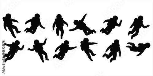 Schilderij op canvas Multiple black silhouettes of astronauts in dynamic floating poses against a whi