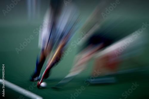 Canvastavla Field hockey players competing for control of the ball on the pitch