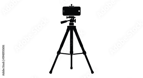 Black camera on tripod studio equipment shown in stark silhouette