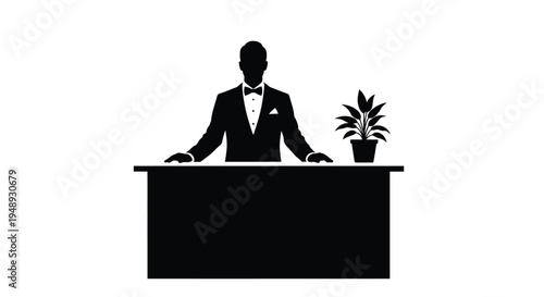 A formal man stands behind a desk with a plant silhouette