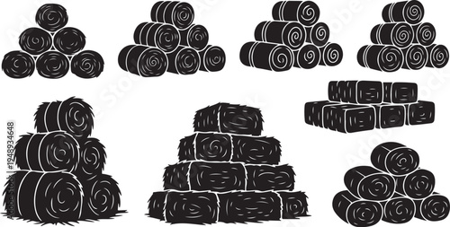 Stacks of rolled up hay bales in black and white