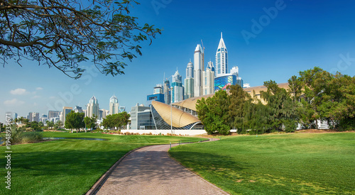 Dubai Marina skyscrapers and golf course near bay,Dubai,United Arab Emirates
