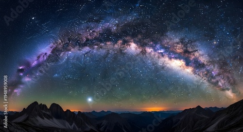Stellar milky way galaxy over sharp mountain peaks under vast starry sky with bright celestial light .