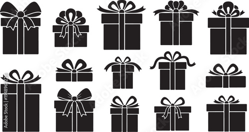 Black gift boxes with white ribbons and bows arranged