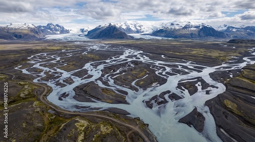 Aerial View of Braided Glacial River System, Volcanic Landscape, Snow-Capped Mountains, Glacier, Iceland