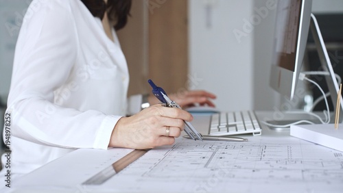 Slika na platnu Architect working on building blueprint plans, designing new projects with computer and drawing tools