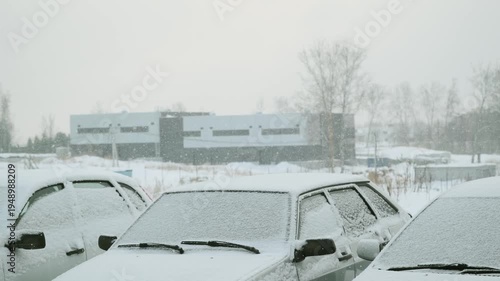 Wallpaper Mural Snow falling against a backdrop of parked cars Torontodigital.ca