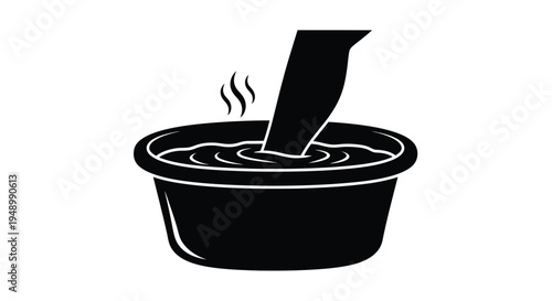 A black silhouette of a foot sinking into a bowl of liquid