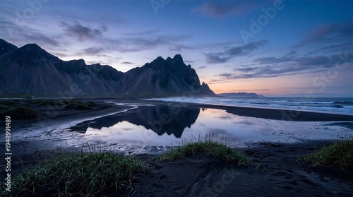 Dramatic Vestrahorn Mountain Peaks Reflected on Black Sand Beach at Stokksnes, Iceland during Twilight
