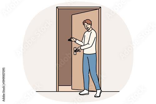Man says welcome standing near door and shows inviting gesture when friends come to visit. Guy demonstrating welcome sign with palm, showing friendly and hospitable character traits