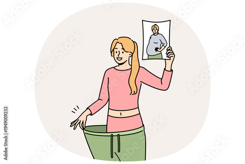 Lost weight woman in huge pants, showing own old photo with big belly and fat or cellulite on hips. Lost weight girl is proud of transformation achieved thanks to low-carb diet and regular fitness