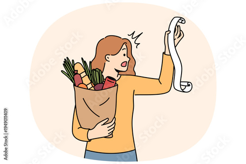 Huge bill for healthy food shocks woman who opens mouth, reading store receipt. Girl with bag healthy food products, disoriented due to sharp inflation of costs for organic fruits and vegetables.
