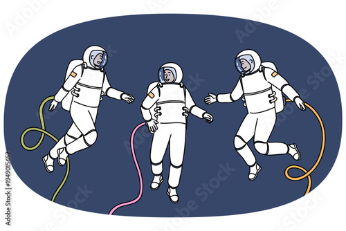 Group of astronauts participating in space research mission floats in zero gravity, dressed in spacesuits. Teamwork of astronauts going on scientific expedition in orbit of planet or in galaxy