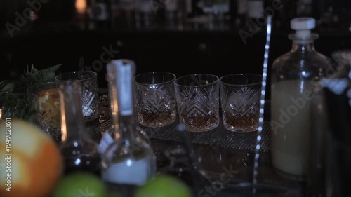 Close-up of rum and whisky glasses behind bar