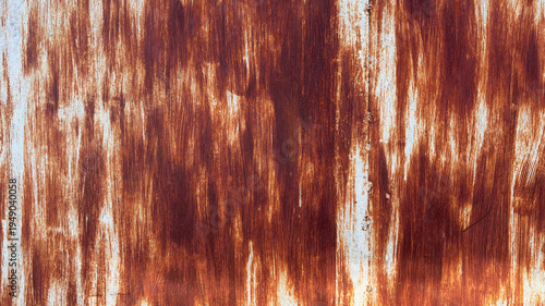 Billede på lærred Rust streaks dance across weathered metal surface