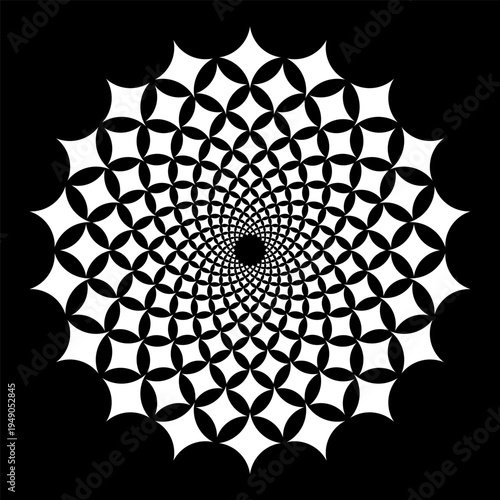 A circular pattern with black and white shapes forming a spiral. The design is detailed with a series of repeating elements radiating out from the center.