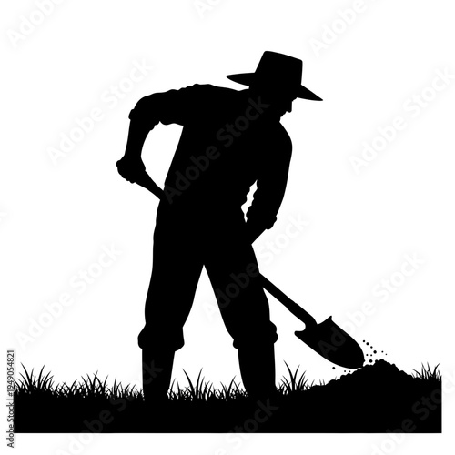 Black silhouette of a farmer working with a shovel in the field at sunset