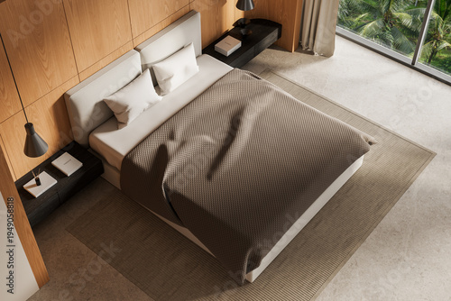 Modern bedroom interior top view with cozy bed, wooden panels, warm lighting, and serene modern design concept creating a peaceful atmosphere."" 3D Rendering