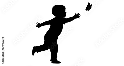 A silhouette of a young child reaching for a fluttering butterfly