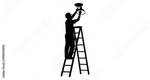 Silhouetted figure installs a ceiling light fixture while standing on a ladder
