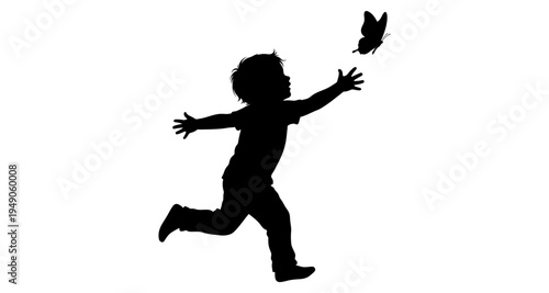 Silhouette of a child reaching for a butterfly in flight