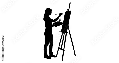 Silhouette of a woman painting at an easel with a palette