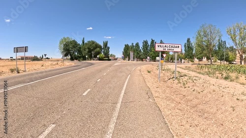 French Way of Saint James - P-980 paved road entering Villalcazar de Sirga, province of Palencia, Castile and Leon, Spain